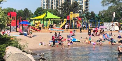 People enjoy warm weather at Centennial Beach in Barrie in a file photo.