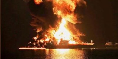 An oil tanker burning after being hit by an Iranian strike at Khor al-Zubair port near Basra, Iraq