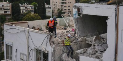 sraeli authorities inspect a house damaged by an Iranian missile strike in Haifa, Israel.