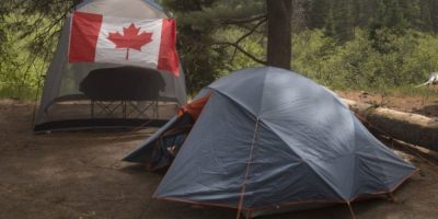 Campers at Algonquin Provincial Park with a Canadian flag at a campsite as Ontario expands alcohol rules in provincial parks