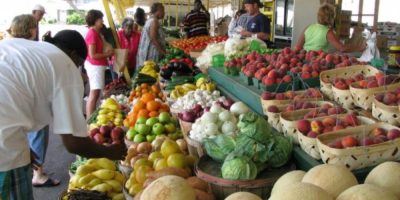 Shoppers browsing vendors at the outdoor Barrie Farmers’ Market in downtown Barrie