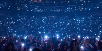 Fans hold up illuminated phones during a concert at Scotiabank Arena in Toronto.