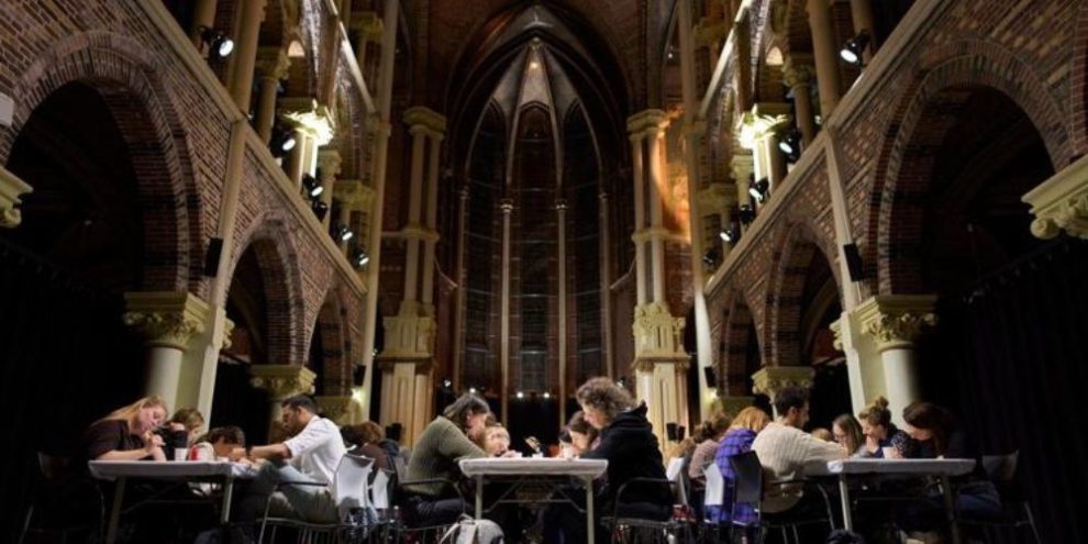 Participants take part in an Offline Club digital detox event in Amsterdam, Netherlands, sitting together in a quiet space without phones