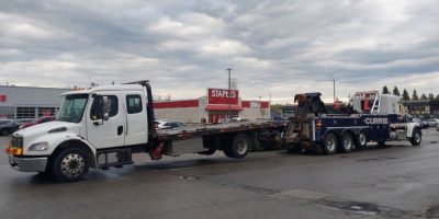 Tow truck sitting on the hoist of another tow truck in Alliston on May 9, 2026, after a driver was charged with impaired driving following an OPP investigation.