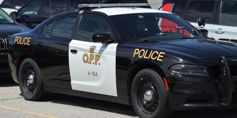 Ontario Provincial Police investigate after a person was shot at an apartment complex on King Street in Midland Friday night.