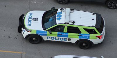 FILE - A Barrie Police cruiser drives north on Maple Avenue in Barrie, Ont., May 22, 2026.