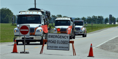 Tow trucks haul away heavily damaged vehicles from the scene of a fatal collision in Mapleton Township, northwest of Kitchener, Ontario, on June 13, 2026.