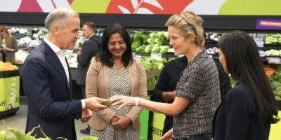 Prime Minister Mark Carney views an Indian bitter melon with Diana Fox Carney inside a FreshCo grocery store in Brampton, Ontario, on June 5, 2026.