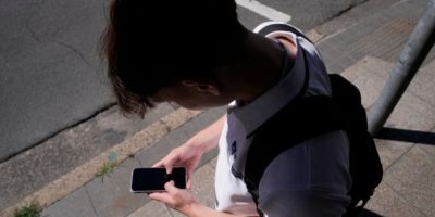 Teenager using a smartphone as Canada considers social media restrictions for children under 16