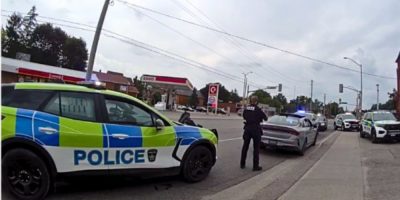 Barrie police officers stop a vehicle during an investigation