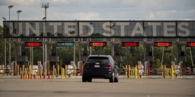 Vehicles approach the United States border as seen at Saint Bernard de Lacolle, Que., on Monday, July 21, 2025.