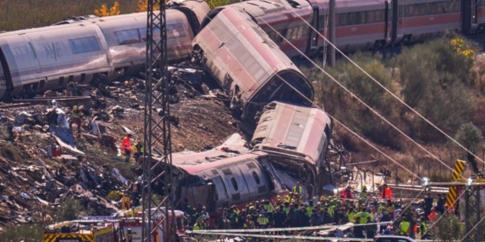 Emergency crews work at the scene of a collision between two trains in Urda, Spain.