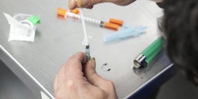 A client draws up fentanyl at a supervised consumption site in Toronto.