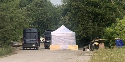 Barrie police investigate a homeless encampment near Anne Street South and Victoria Street in August 2025.