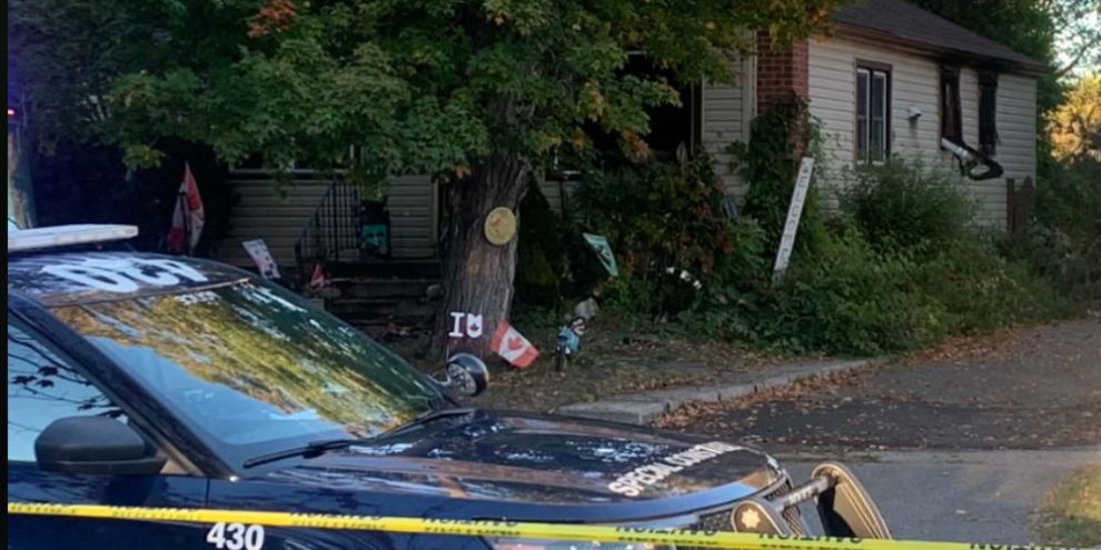 Barrie Police tape at the scene of a house fire on Alfred Street in Barrie on Oct. 2, 2026.